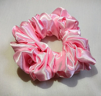 Soft silk scrunchies, perfect for everyday wear or special occasions. Stylish and gentle on hair for a smooth, comfortable hold