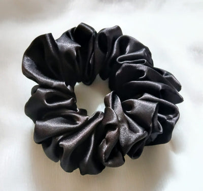 Soft silk scrunchies, perfect for everyday wear or special occasions. Stylish and gentle on hair for a smooth, comfortable hold