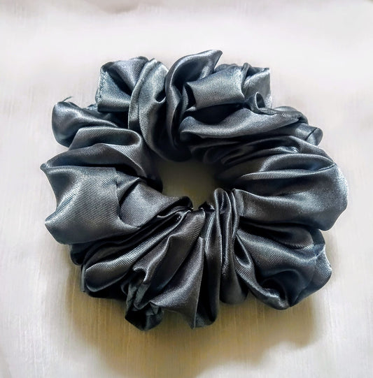 Soft silk scrunchies, perfect for everyday wear or special occasions. Stylish and gentle on hair for a smooth, comfortable hold